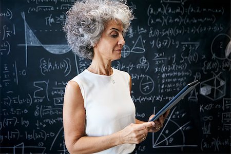 simsearch:614-06043814,k - Middle aged academic woman working at blackboard Stock Photo - Budget Royalty-Free & Subscription, Code: 400-09121926