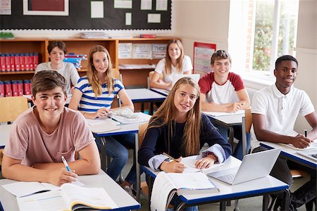 Portrait Of Students Sitting At Desks In Classroom Stock Photo - Budget Royalty-Free & Subscription, Code: 400-09122026