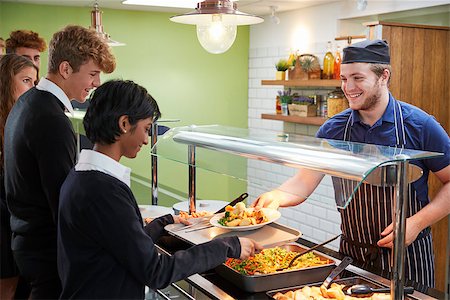 Teenage Students Being Served Meal In School Canteen Stock Photo - Budget Royalty-Free & Subscription, Code: 400-09122076