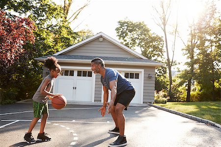 Father And Son Playing Basketball On Driveway At Home Stock Photo - Budget Royalty-Free & Subscription, Code: 400-09122256