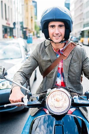 Tourist in Berlin riding scooter in dense traffic Stock Photo - Budget Royalty-Free & Subscription, Code: 400-09136382