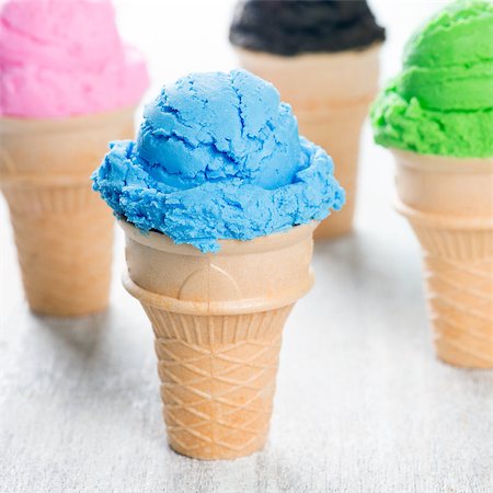simsearch:400-05718903,k - Chocolate, matcha, blueberry and strawberry ice cream in the cone on wooden background. Stock Photo - Budget Royalty-Free & Subscription, Code: 400-09151395