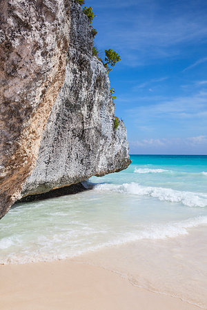 On the amazing beach in Mayan ruins in Tulum.Tulum is a resort town on Mexicos Caribbean coast. The 13th-century, walled Mayan archaeological site at Tulum National Park overlooks the sea. Stock Photo - Budget Royalty-Free & Subscription, Code: 400-09193374