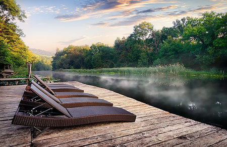 simsearch:400-04756224,k - Wicker chaise longues near river at foggy sunrise Stock Photo - Budget Royalty-Free & Subscription, Code: 400-09224453