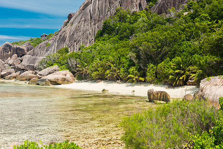 simsearch:400-05745636,k - Beautifully shaped granite boulders and a perfect white sand at Anse Pierrot beach, La Digue island, Seychelles Stock Photo - Budget Royalty-Free & Subscription, Code: 400-09225125