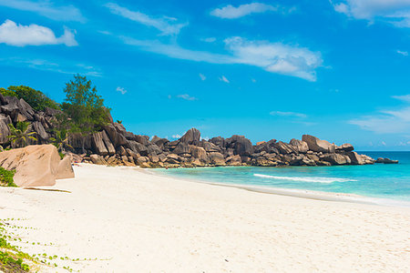 simsearch:400-05745636,k - Beautifully shaped granite boulders and a perfect white sand at Grand Anse, La Digue island, Seychelles Stock Photo - Budget Royalty-Free & Subscription, Code: 400-09225122