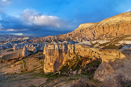 Cylindrical stone cliffs and cave houses near Goreme, Turkey Stock Photo - Budget Royalty-Free & Subscription, Code: 400-09225427