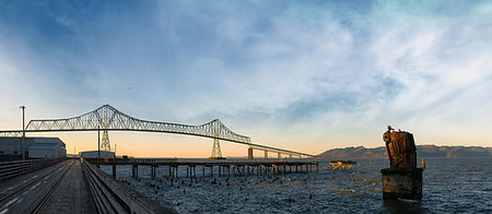 By the Astoria-Megler Bridge on Riverwalk by Columbia River at Oregon Coast Panorama Stock Photo - Budget Royalty-Free & Subscription, Code: 400-09221024