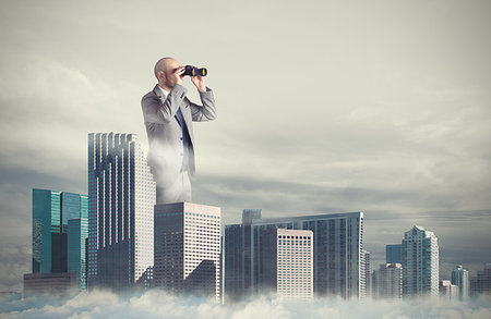 Big businessman emerges from the skyscrapers with binoculars Stock Photo - Budget Royalty-Free & Subscription, Code: 400-09221135