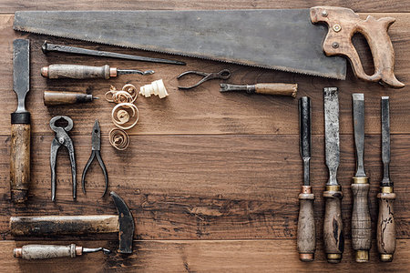 simsearch:600-00073204,k - Frame composed of a collection of vintage woodworking tools on a workbench: carpentry, craftsmanship and handwork concept, flat lay Stock Photo - Budget Royalty-Free & Subscription, Code: 400-09221559
