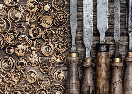 simsearch:600-00073204,k - Set of used professional carving tools on the workbench and wood shavings close up: carpentry, craftsmanship and handwork concept Stock Photo - Budget Royalty-Free & Subscription, Code: 400-09221569