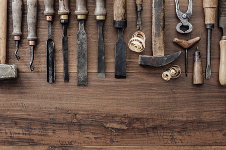 simsearch:600-00073204,k - Set of vintage woodworking and carving tools on a rough workbench, blank copy space: carpentry, craftsmanship and handwork concept, flat lay Stock Photo - Budget Royalty-Free & Subscription, Code: 400-09221561