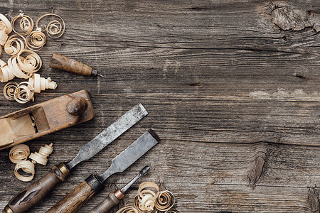 Old used woodworking tools on a vintage workbench: carpentry, craftsmanship and handwork concept Stock Photo - Budget Royalty-Free & Subscription, Code: 400-09221563