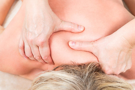 simsearch:400-05318677,k - Masseur makes a massage of the cervical spine with bold hands Stock Photo - Budget Royalty-Free & Subscription, Code: 400-09237621