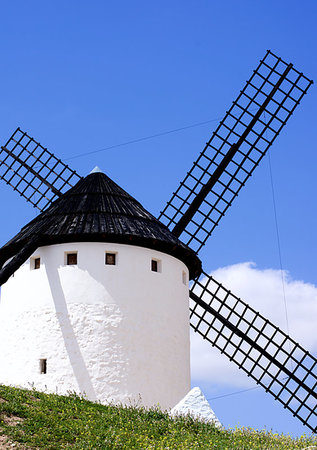 Famous Old Spanish Windmill Windmill Cueva Silo in Campo de Criptana Cross Section on Blue Cloudy Sky Outdoors. Castilla La Mancha, Spain Stockbilder - Microstock & Abonnement, Bildnummer: 400-09237734