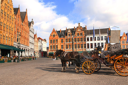 Old houses and horse carriages on Grote Markt square, medieval city Brugge, Belgium, Europe. UNESCO world heritage site Stock Photo - Budget Royalty-Free & Subscription, Code: 400-09274061