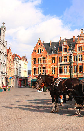 Old houses and horse carriages on Grote Markt square, medieval city Brugge, Belgium, Europe. UNESCO world heritage site Stock Photo - Budget Royalty-Free & Subscription, Code: 400-09274793