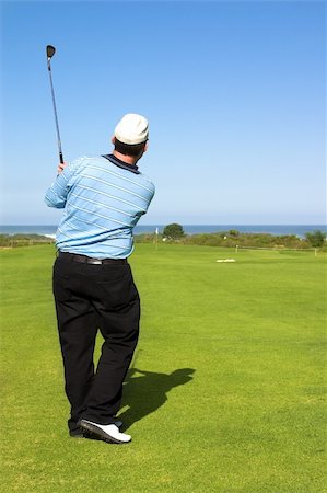 Golfer following the shot. Stock Photo - Budget Royalty-Free & Subscription, Code: 400-03907814