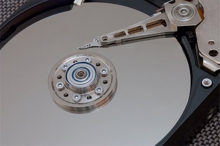 simsearch:400-05238336,k - Hard disk drive with its cover open Stock Photo - Budget Royalty-Free & Subscription, Code: 400-03909099