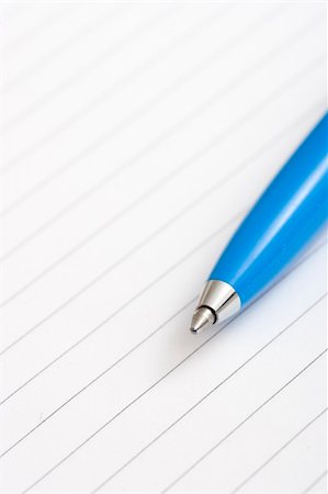 simsearch:6109-08395080,k - blue pen on white notebook Stock Photo - Budget Royalty-Free & Subscription, Code: 400-03909169