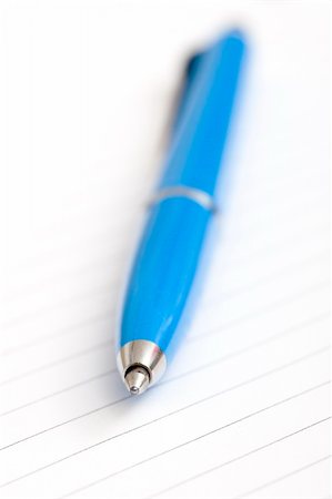 simsearch:6109-08395080,k - blue pen on white notebook Stock Photo - Budget Royalty-Free & Subscription, Code: 400-03909171