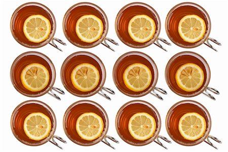 simsearch:400-04273561,k - Many glass cups of tea with one slice of lemon forming background Stock Photo - Budget Royalty-Free & Subscription, Code: 400-03914782