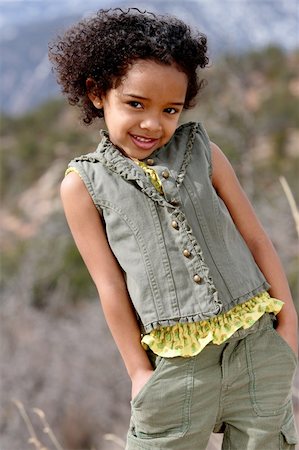 Cute little girl doing fashion photo shoot in a mountains Stock Photo - Budget Royalty-Free & Subscription, Code: 400-03914820