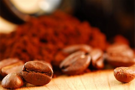 simsearch:700-03698239,k - Macro image of coffee beans and ground coffee with black coffee cup Stock Photo - Budget Royalty-Free & Subscription, Code: 400-03914978