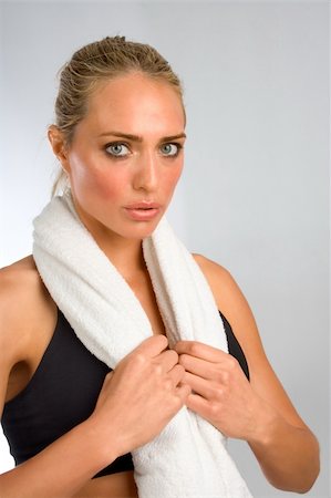 simsearch:400-03976636,k - Tired sweaty girl with white towel around her neck Stock Photo - Budget Royalty-Free & Subscription, Code: 400-03916343