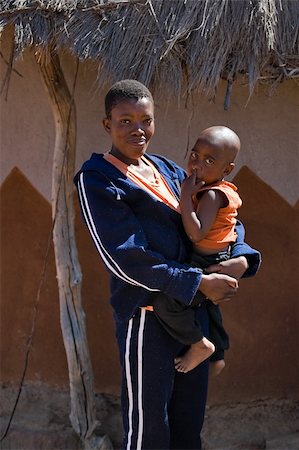 poor africans - single parent african mother and child portrait. Africa, Botswana. Stock Photo - Budget Royalty-Free & Subscription, Code: 400-03916537