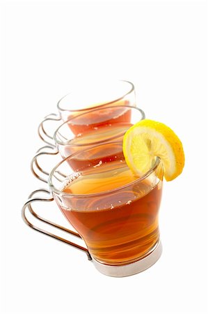 simsearch:700-03698239,k - Three glass cups of tea with one slice of lemon. Shallow dof Stock Photo - Budget Royalty-Free & Subscription, Code: 400-03916781