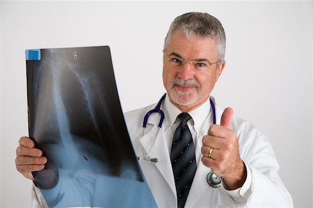 experiencing - Doctor with a thumbs up after evaluating an x-ray, Stock Photo - Budget Royalty-Free & Subscription, Code: 400-03916967