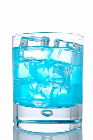 simsearch:649-07065069,k - Glass of blue paradise cocktail with ice cubes reflected on white background Stock Photo - Budget Royalty-Free & Subscription, Code: 400-03917773
