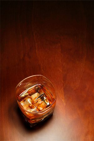 simsearch:400-04558755,k - Whiskey in light pool on brown table with copyspace Stock Photo - Budget Royalty-Free & Subscription, Code: 400-03918794