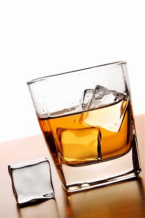 simsearch:400-04558755,k - Glass of Whiskey with ice cube Stock Photo - Budget Royalty-Free & Subscription, Code: 400-03910223