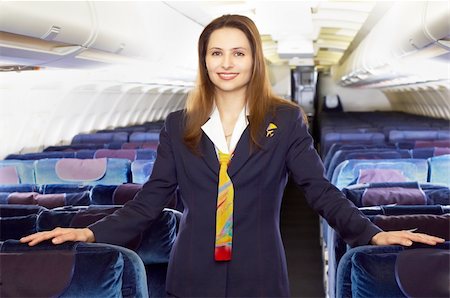 servicing a plane - air hostess (stewardess) in the empty airliner cabin Stock Photo - Budget Royalty-Free & Subscription, Code: 400-03911148