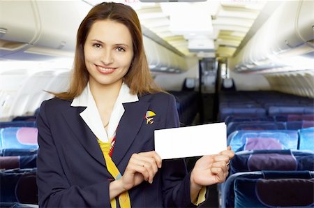 servicing a plane - series: air hostess (stewardess) in the empty airliner cabin Stock Photo - Budget Royalty-Free & Subscription, Code: 400-03911149