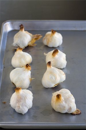 simsearch:400-06079651,k - Bulbs of Roasted Garlic on a roasting pan fresh out of the oven Stock Photo - Budget Royalty-Free & Subscription, Code: 400-03911425