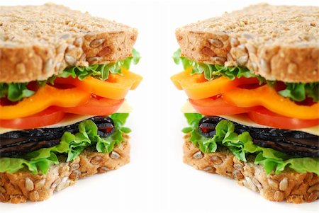 simsearch:700-01716556,k - Big healthy sandwich with vegetables and meat close up on white background Photographie de stock - Aubaine LD & Abonnement, Code: 400-03911485