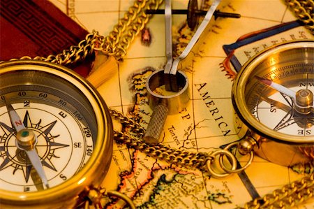 Old style brass compass on antique  map Stock Photo - Budget Royalty-Free & Subscription, Code: 400-03911521