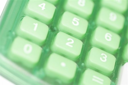 Close-up of buttons on a green colored calculator. Photographie de stock - Aubaine LD & Abonnement, Code: 400-03912436