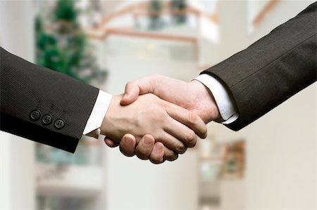 simsearch:400-04434336,k - business hand shake and a office in background Stock Photo - Budget Royalty-Free & Subscription, Code: 400-03912576