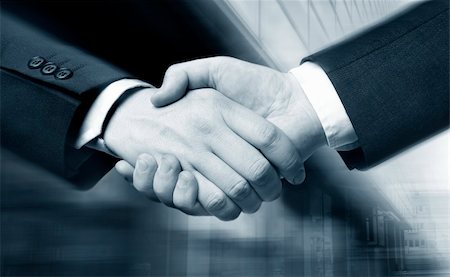 simsearch:400-04434336,k - business hand shake and a office in background,  Suit slightly motion blur, focus at the hands Stock Photo - Budget Royalty-Free & Subscription, Code: 400-03912632