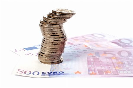simsearch:600-00077457,k - Stack of coins over a euro bills background. Soft shadow Stock Photo - Budget Royalty-Free & Subscription, Code: 400-03912694
