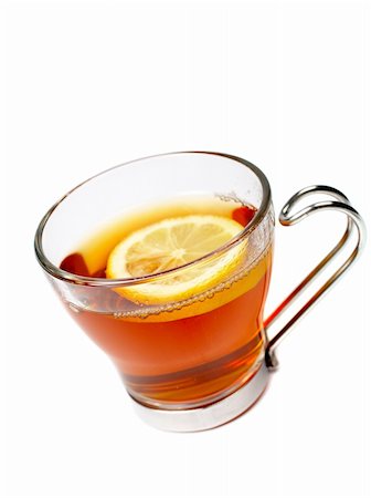 simsearch:700-03698239,k - A glass cup of tea with one slice of lemon. Soft shadow and shallow dof Stock Photo - Budget Royalty-Free & Subscription, Code: 400-03912920