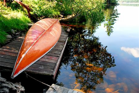 Canoe on wooden dock on a lake Stock Photo - Budget Royalty-Free & Subscription, Code: 400-03912937