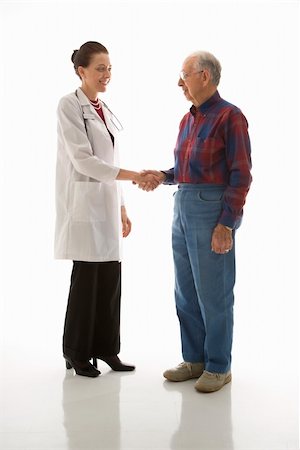 Mid-adult Caucasian female doctor shaking hands with an elderly Caucasian male. Stock Photo - Budget Royalty-Free & Subscription, Code: 400-03924232