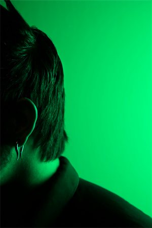 simsearch:700-00933633,k - Close up side view portrait of attractive Asian Filipino young adult man tinted green. Stock Photo - Budget Royalty-Free & Subscription, Code: 400-03924541