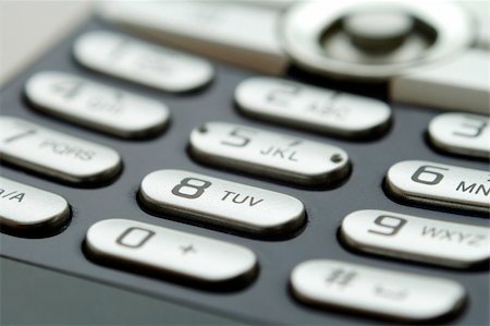 simsearch:600-06702130,k - A close up shot of mobile keypad under light Stock Photo - Budget Royalty-Free & Subscription, Code: 400-03925027
