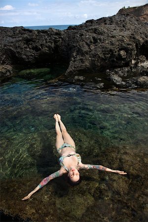 simsearch:400-04450827,k - Sexy Caucasian woman in bikini floating in tidal pool in Maui, Hawaii, USA. Stock Photo - Budget Royalty-Free & Subscription, Code: 400-03925232